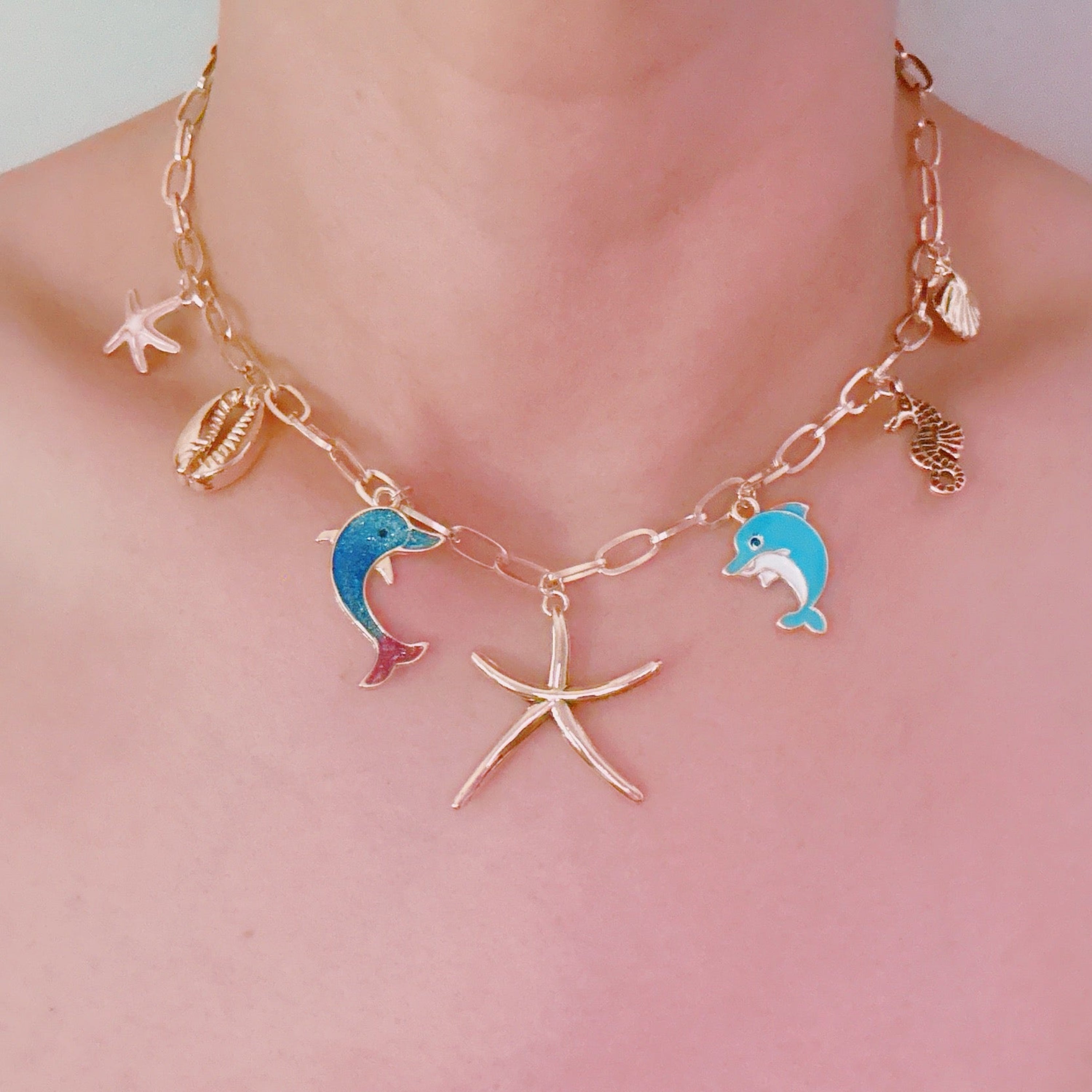 Ocean Play Charm Necklace – Dolphin, Starfish & Shell
