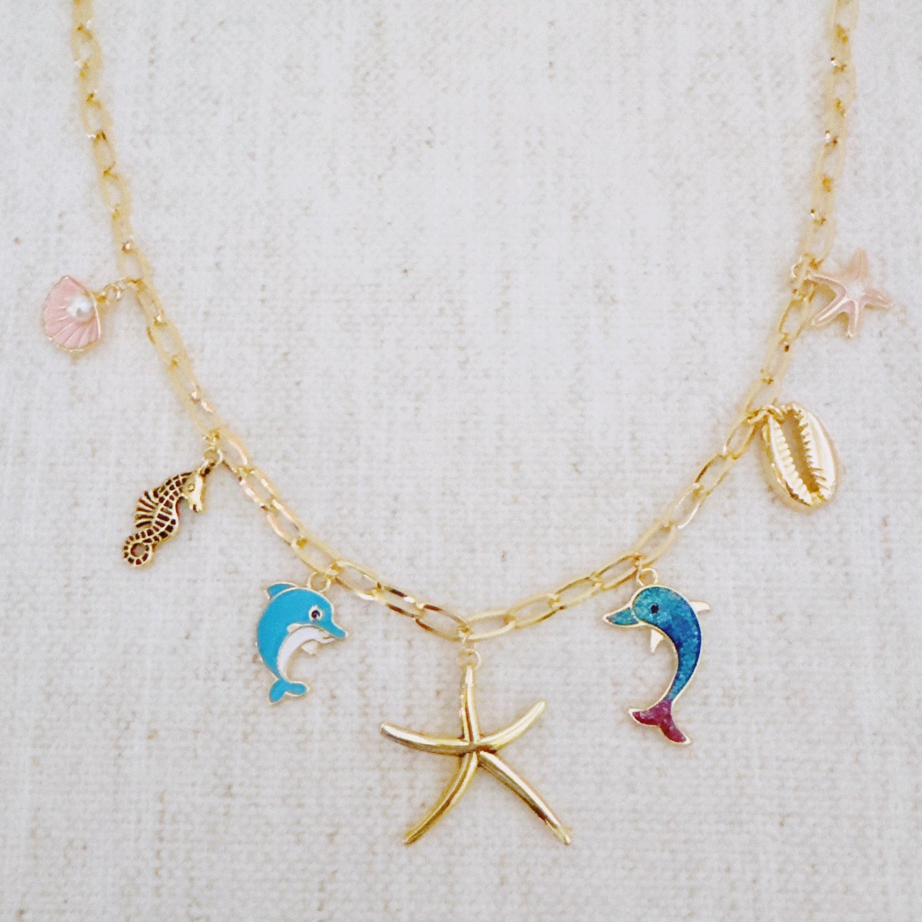 Ocean Play Charm Necklace – Dolphin, Starfish & Shell