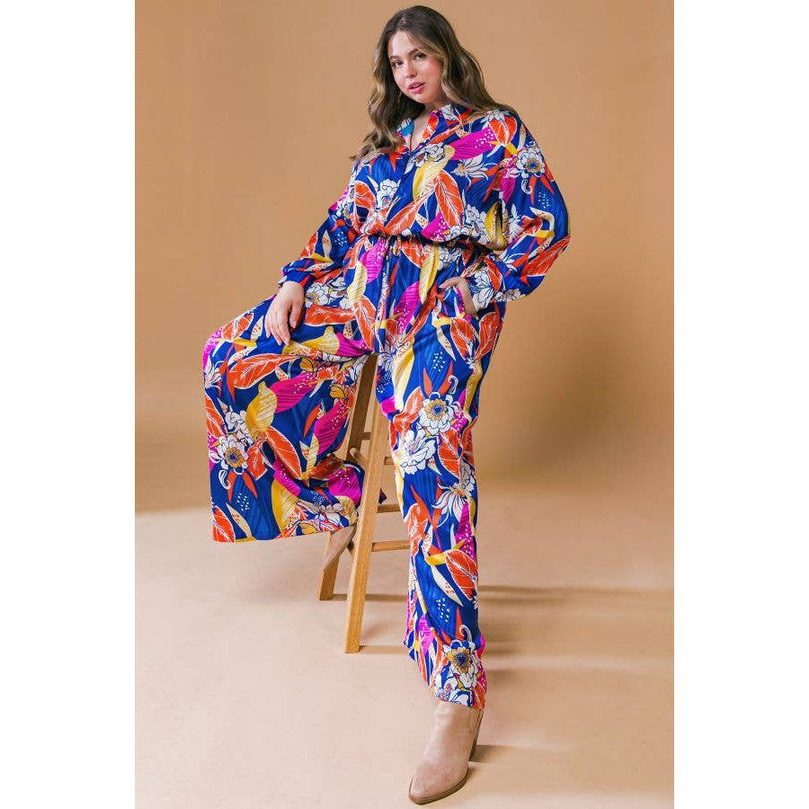 Printed Woven Jumpsuit in Blue with Flowers And Leaf Designs | Long Sleeve Romper